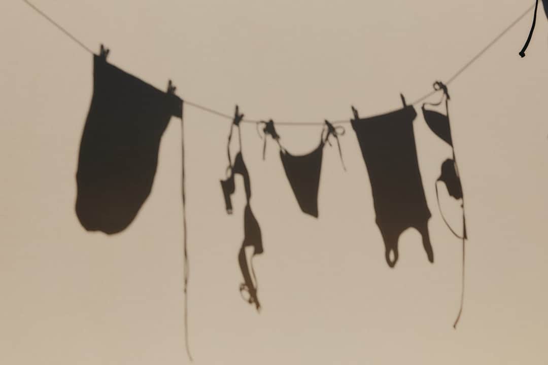 Black lingerie hanging on clothesline for sustainable air-drying