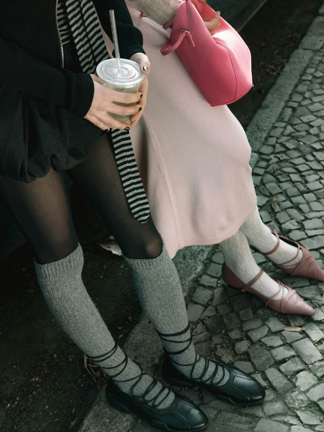 Women in matching sage striped socks and occasionwear enjoying drinks