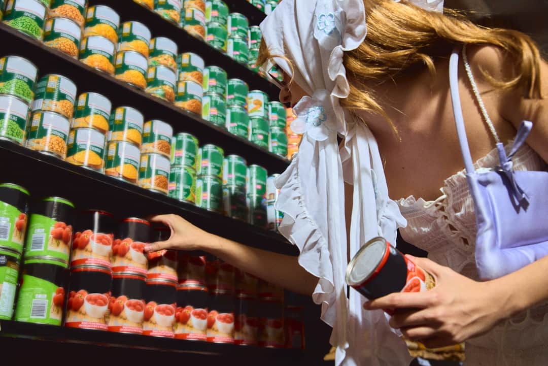 Customer selecting branded products from corner store shelves