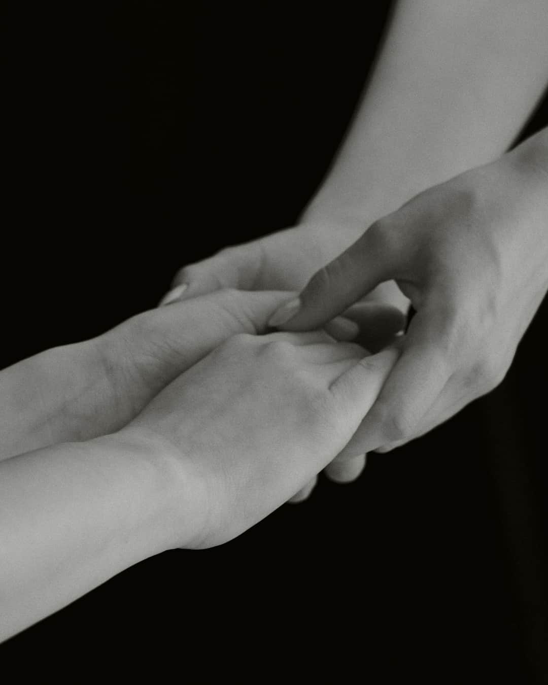 Hands coming together representing unity and support for charitable giving