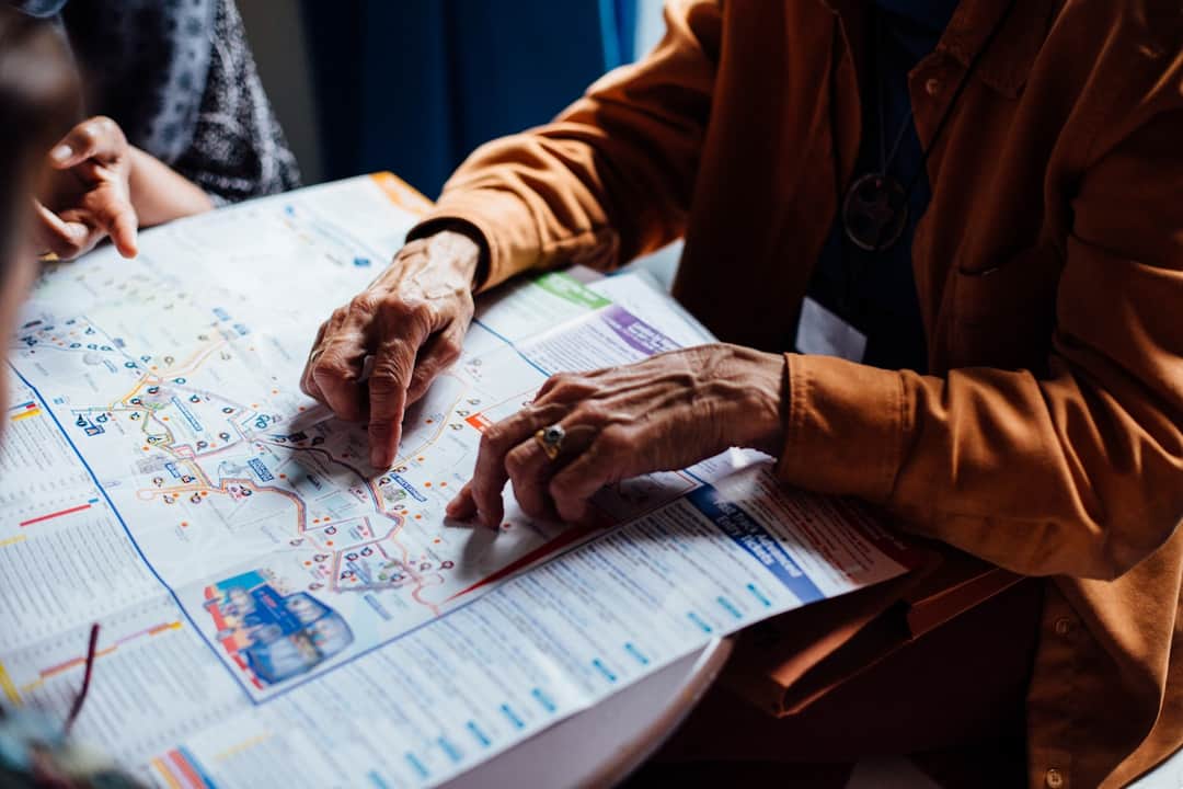 Hands collaborating around local map during community event