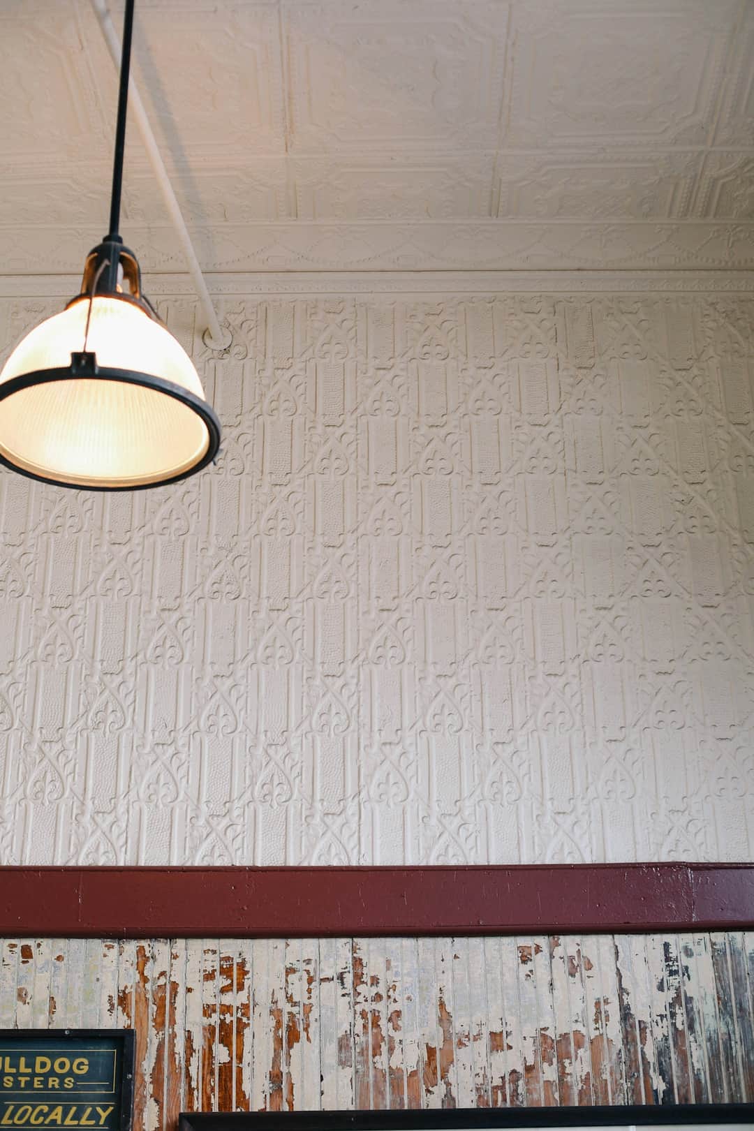 Industrial pendant light with white dome shade in home interior design