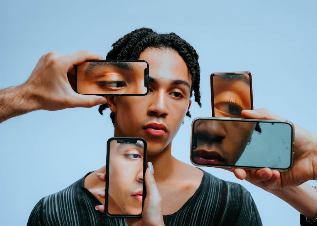 Multiple phones displaying fragmented face reflecting search results evolution