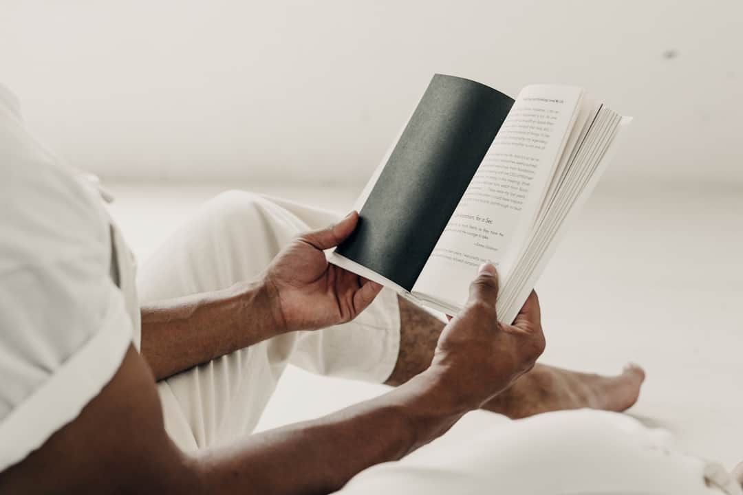 Hands holding open book about search term visibility and reporting