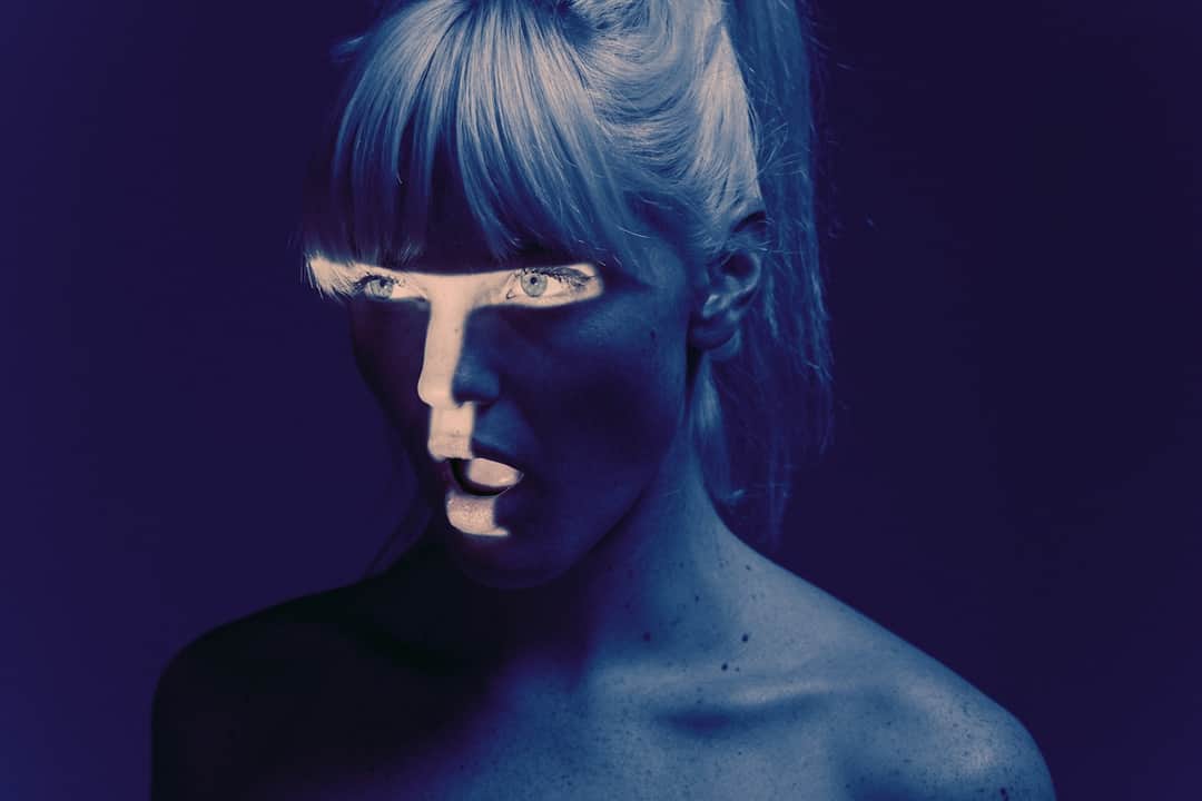 Artistic blue-toned portrait representing data-driven digital strategy