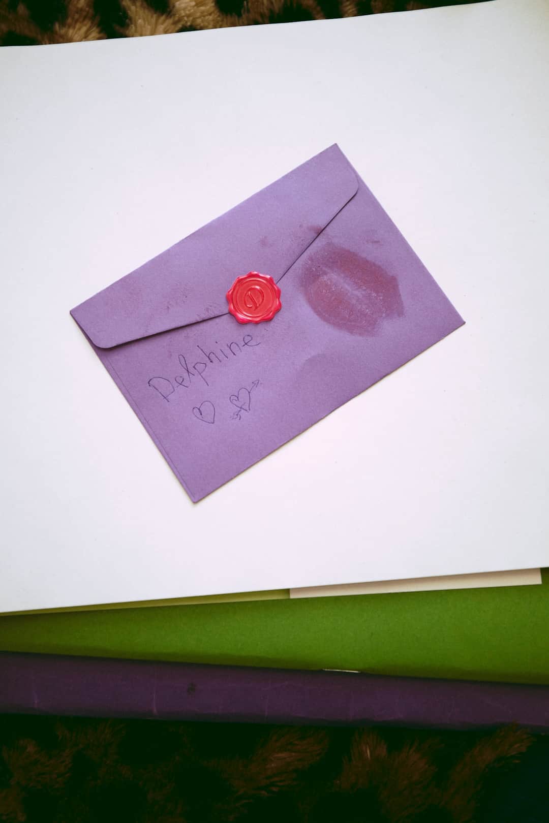 Purple greeting card envelope with handwritten inscription and red wax seal