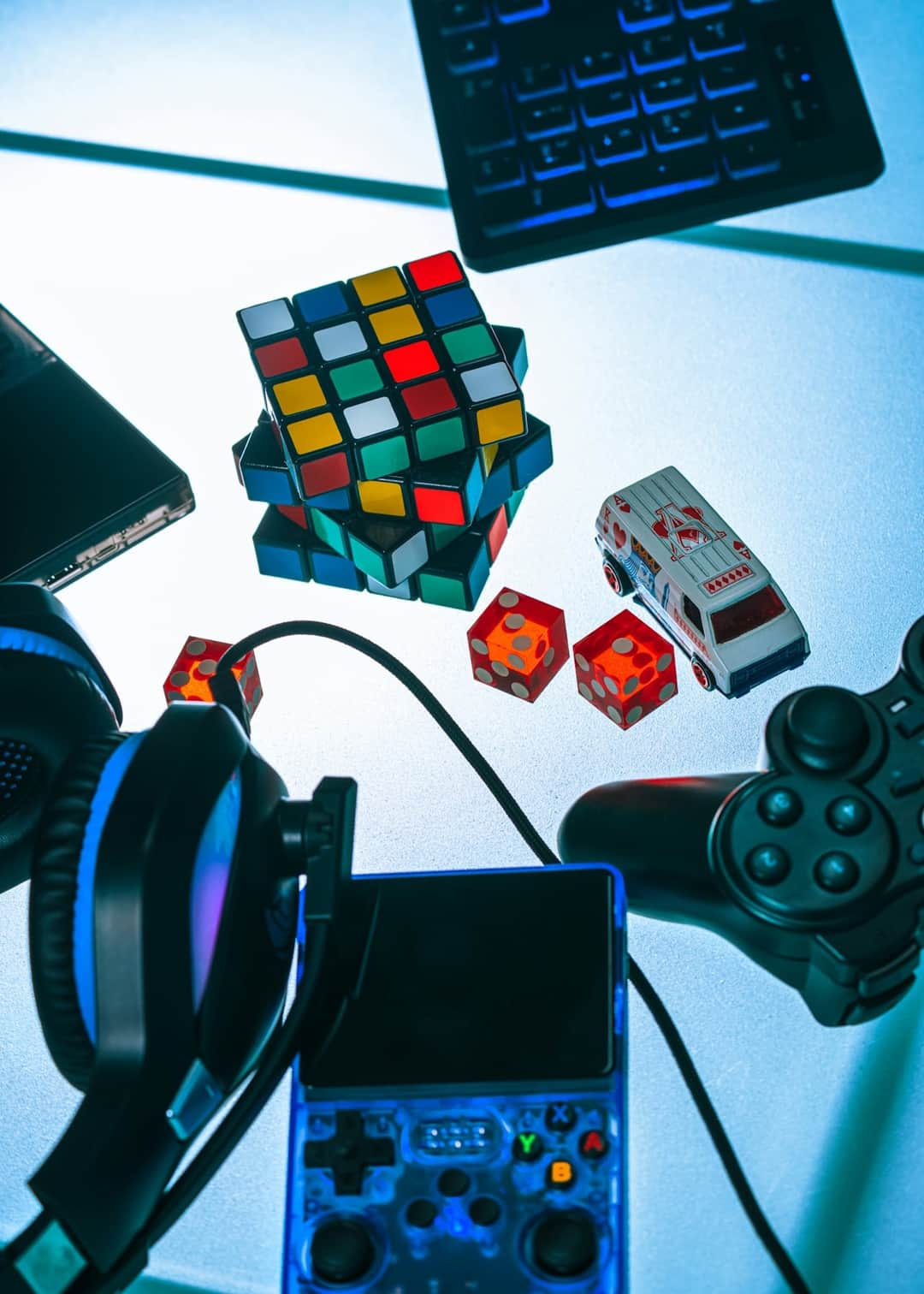 Toy gaming products including Rubik's Cube, video game controllers, headphones and accessories