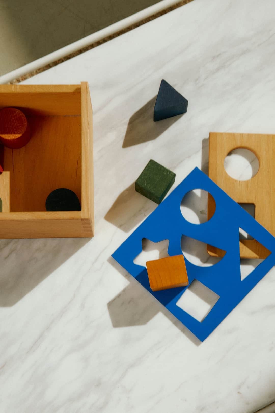 Wooden shape sorters and geometric toy blocks for toddler learning