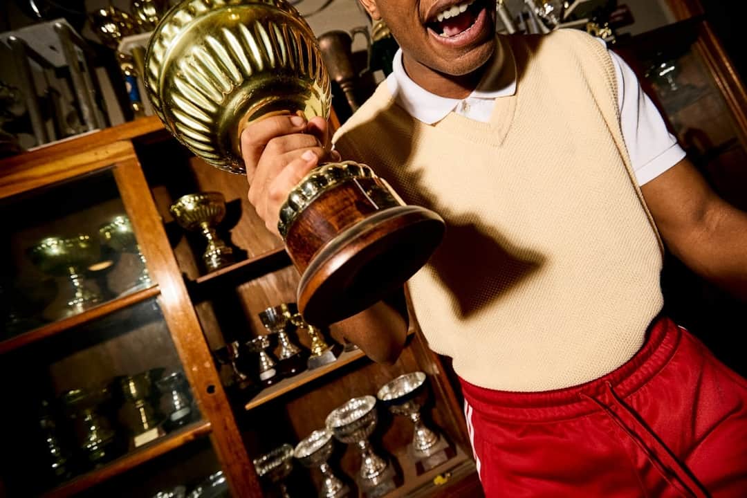 Man celebrating with championship trophy exemplifying brand achievement