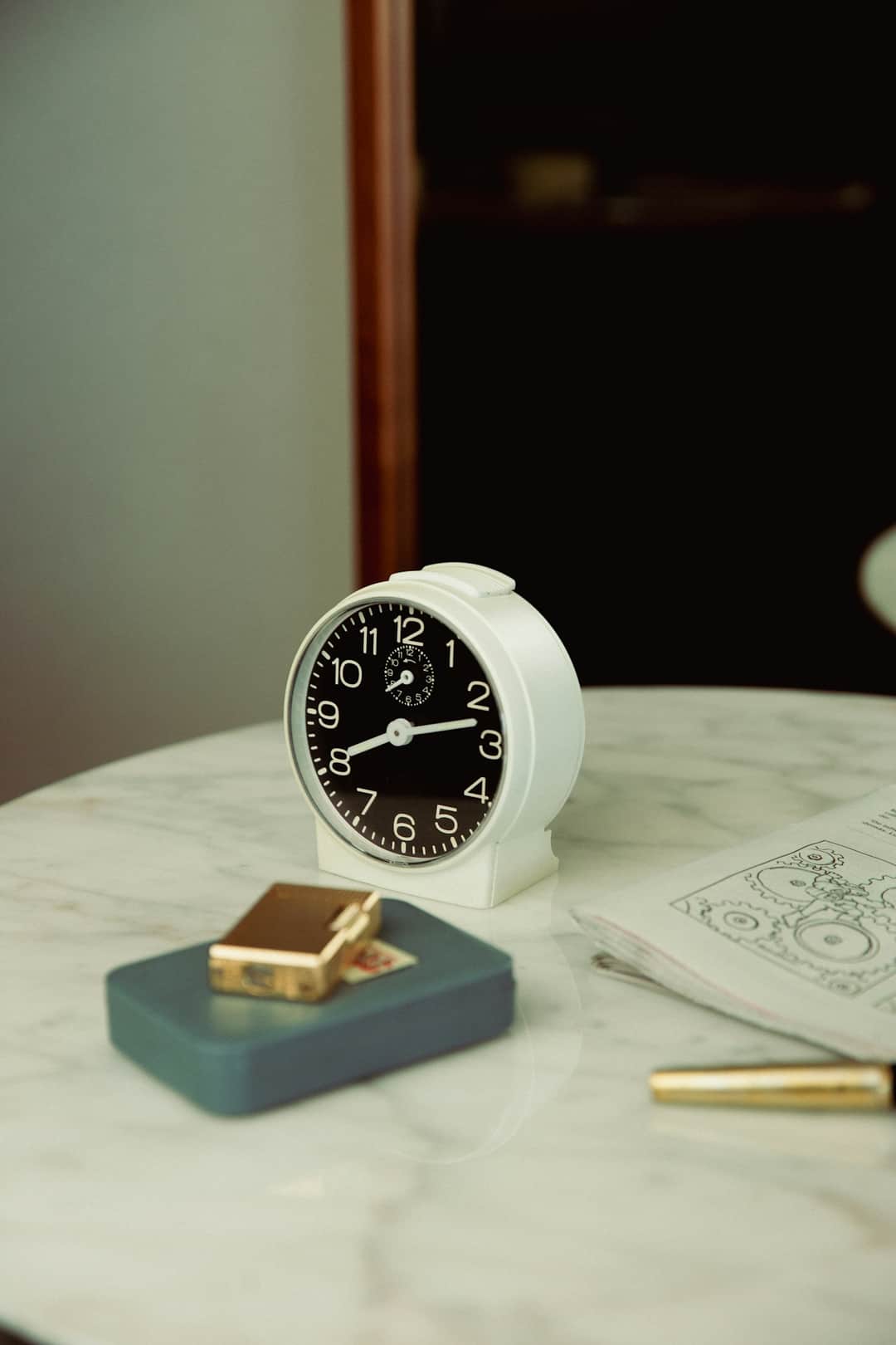 White retro alarm clock on marble workspace illustrating conversion optimization