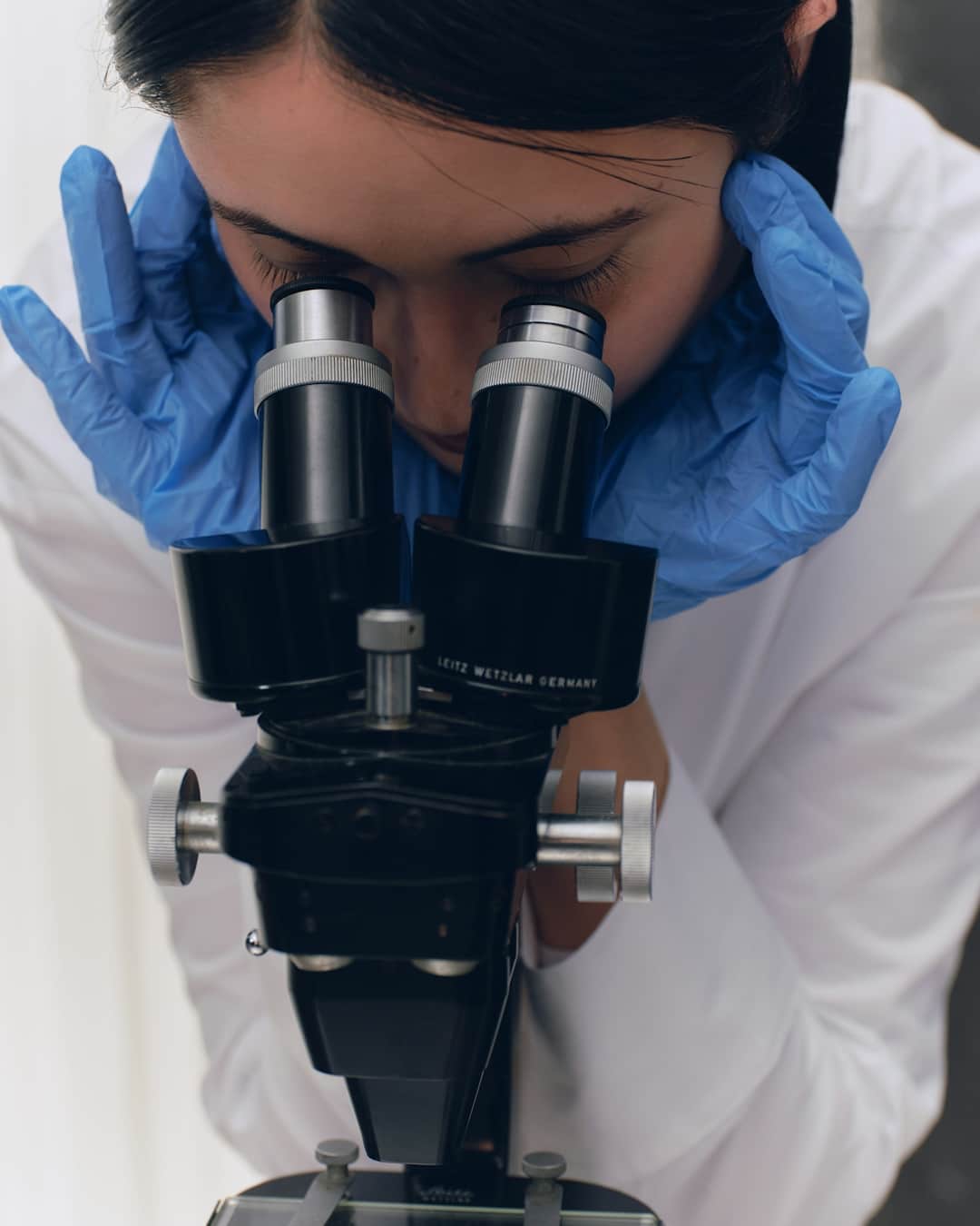 Scientist examining link building myths through microscope
