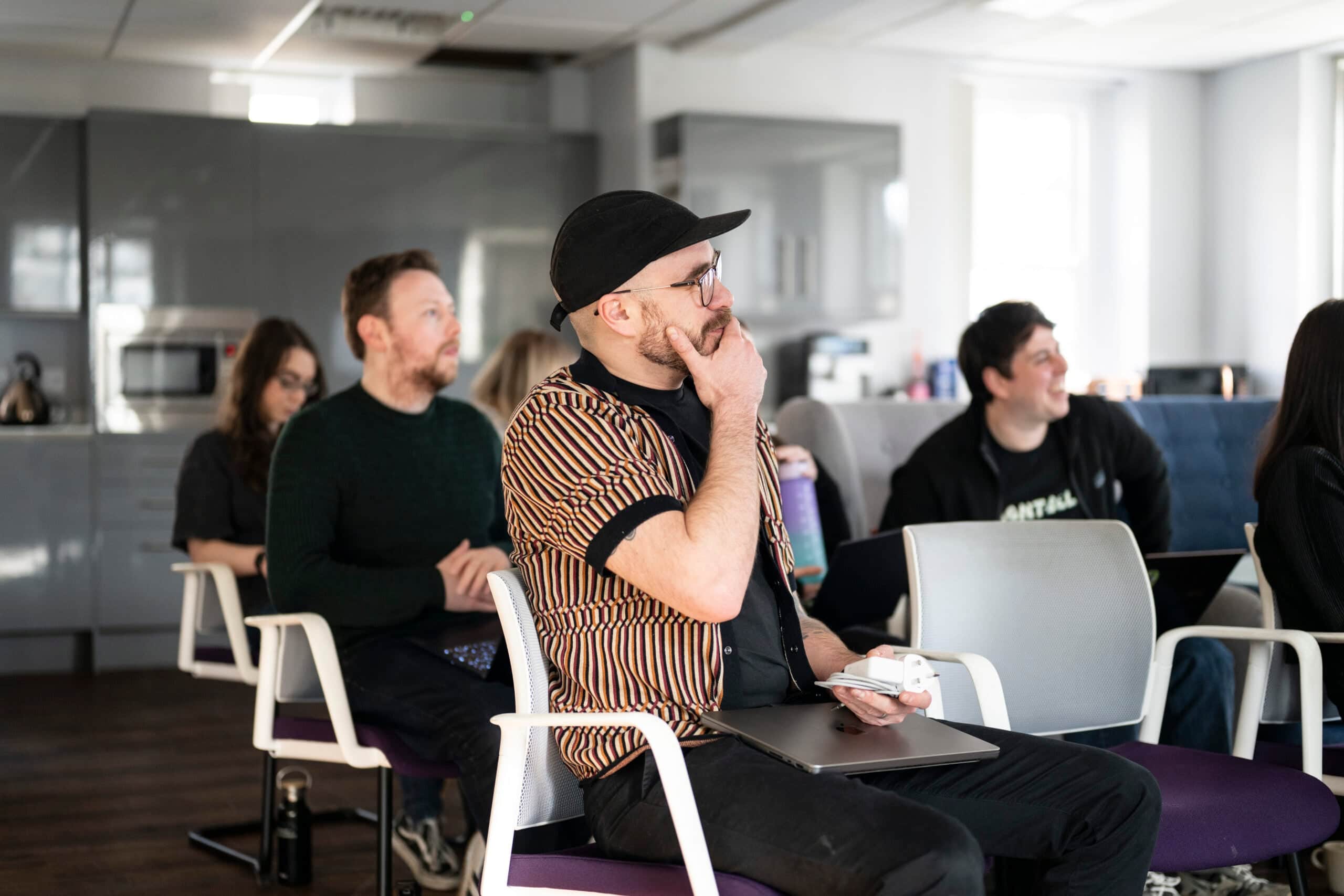 Team members engaged in a marketing workshop at Salience office.