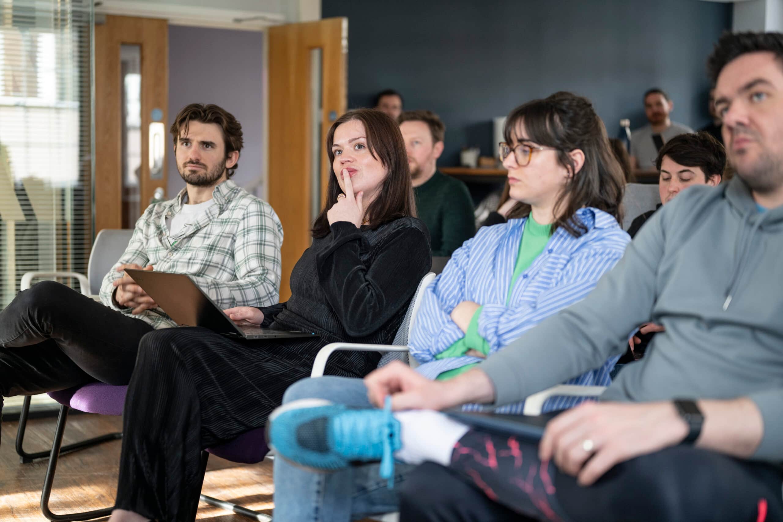 Marketing team discussing content strategy in collaborative office meeting