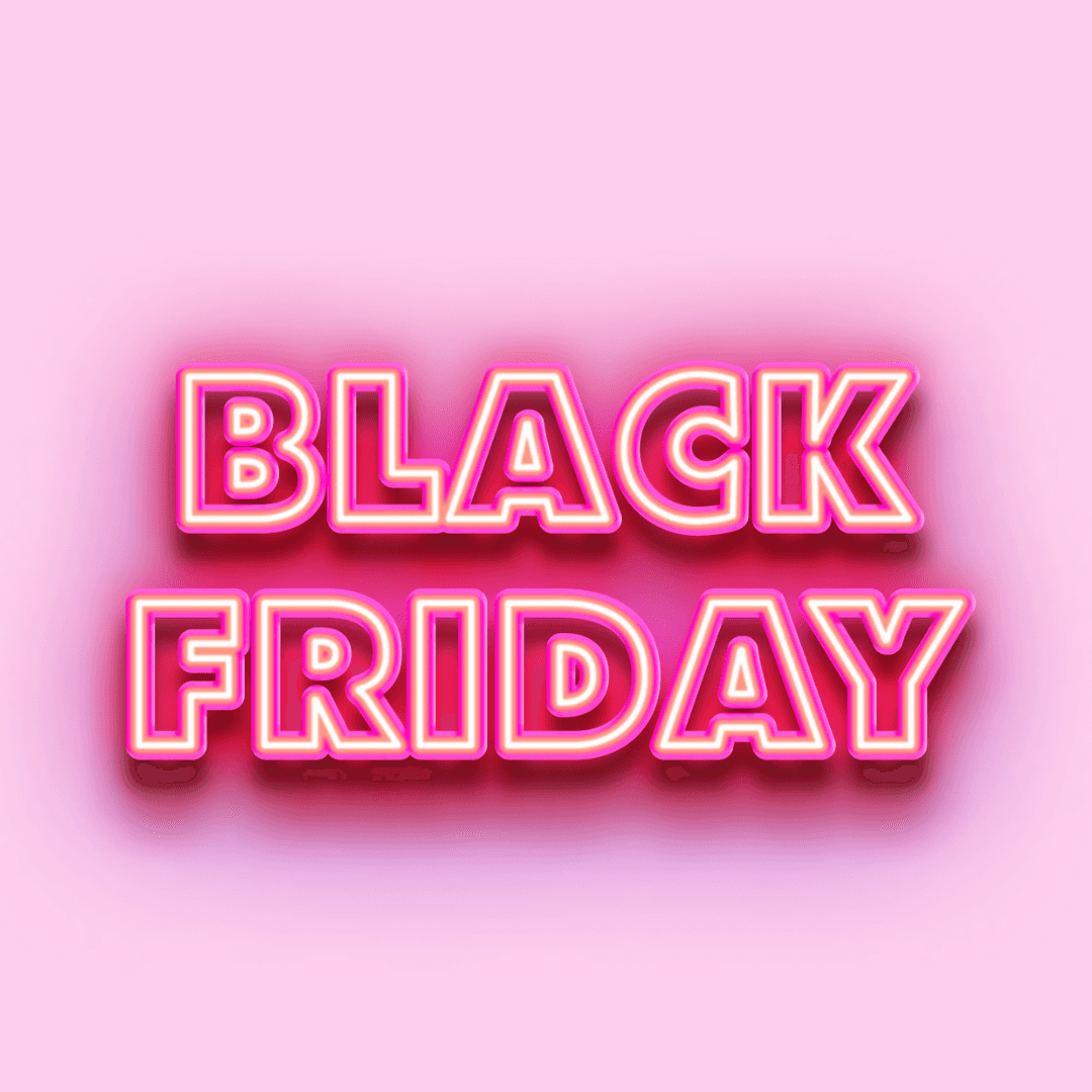 Black Friday text in neon pink on a soft pink background promoting eCommerce strategy for holiday deals.