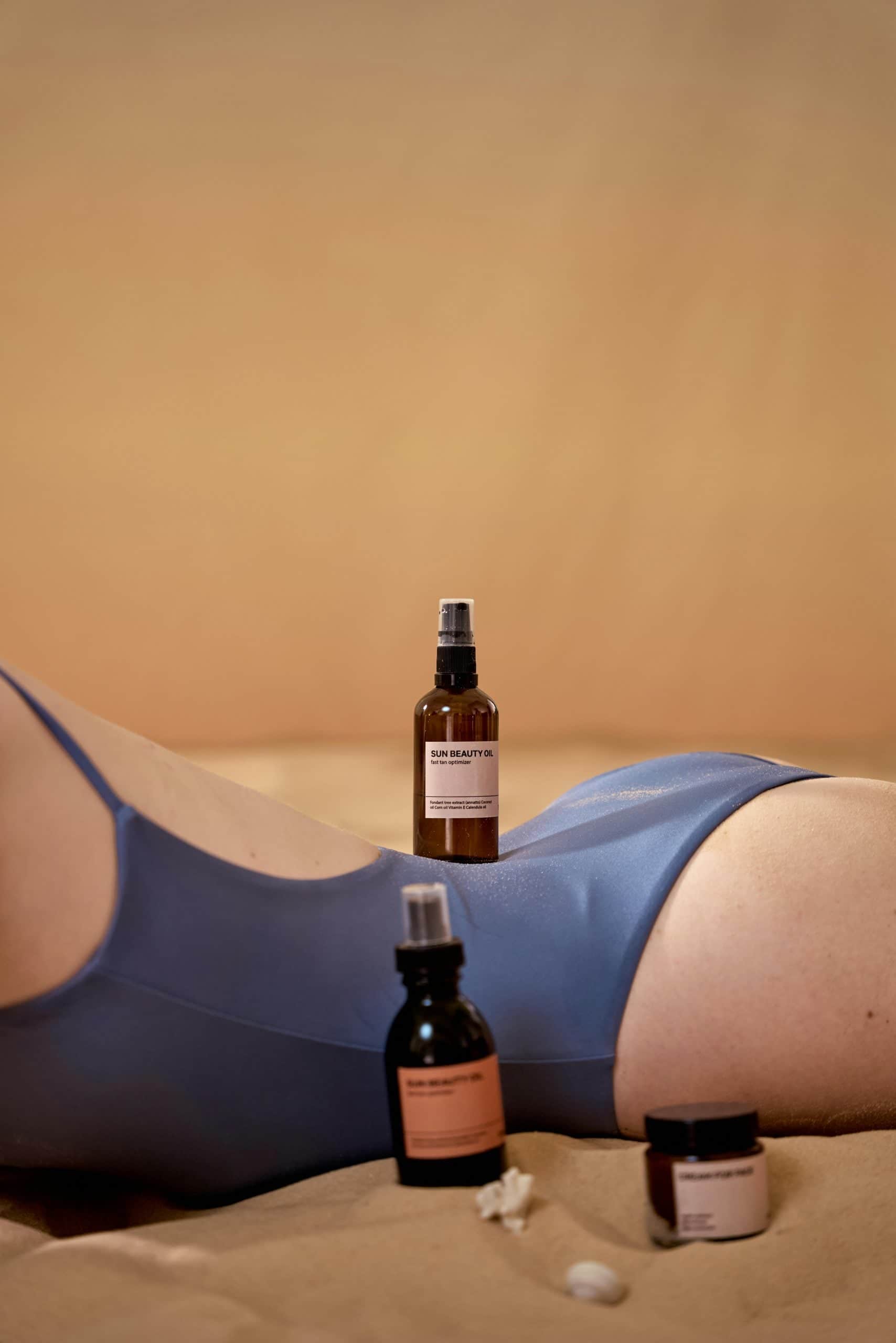 Skincare bottles on a person's back with soft lighting, promoting beauty products.