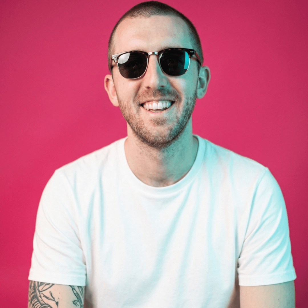 Jack Tear, Salience team member, smiling in sunglasses and light blue shirt