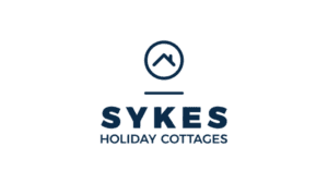 Sykes Holiday Cottages logo with circular house roof symbol in navy