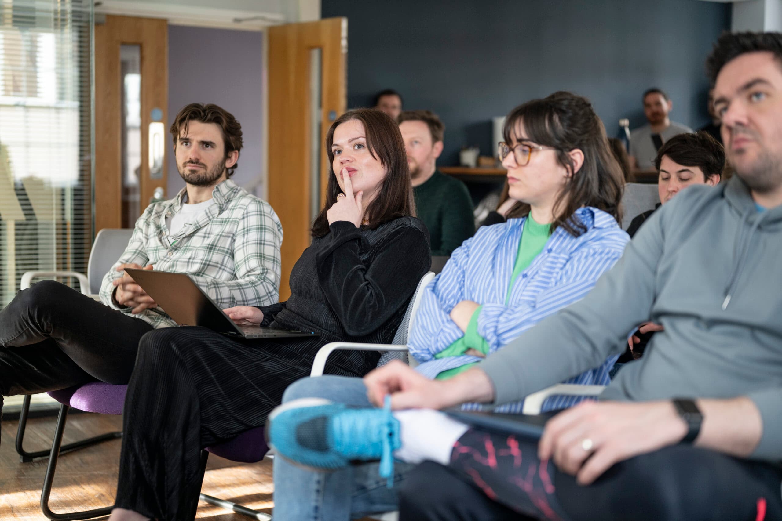 Marketing team discussing content strategy in collaborative office meeting
