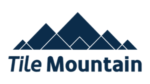 Tile Mountain logo featuring geometric navy blue mountain peaks