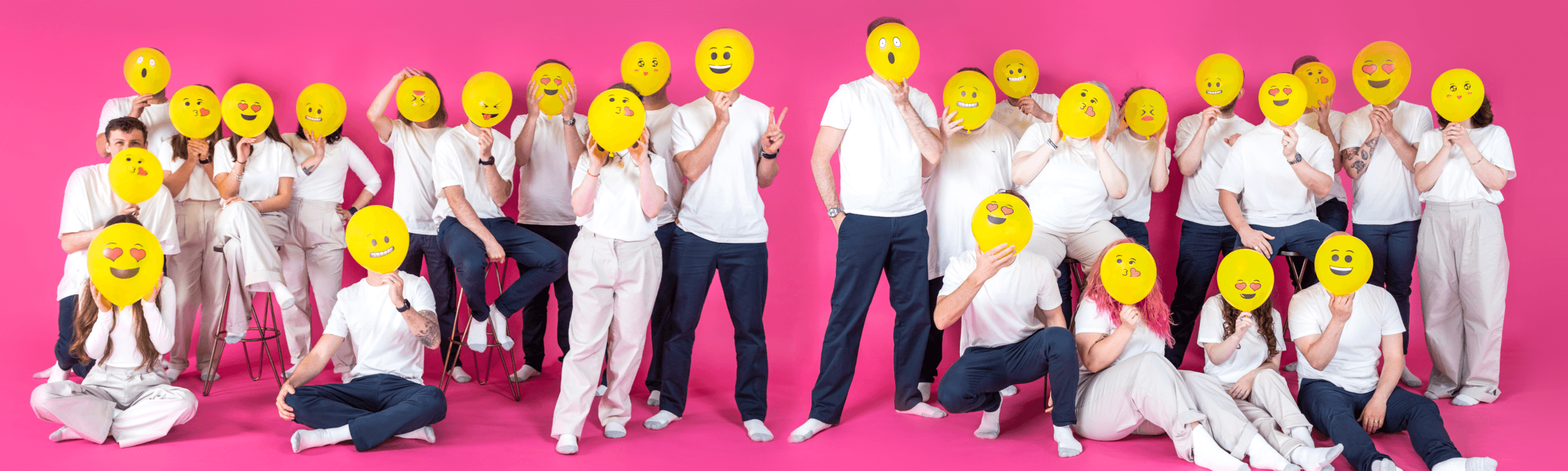Marketing team in white with smiley face icons on pink background